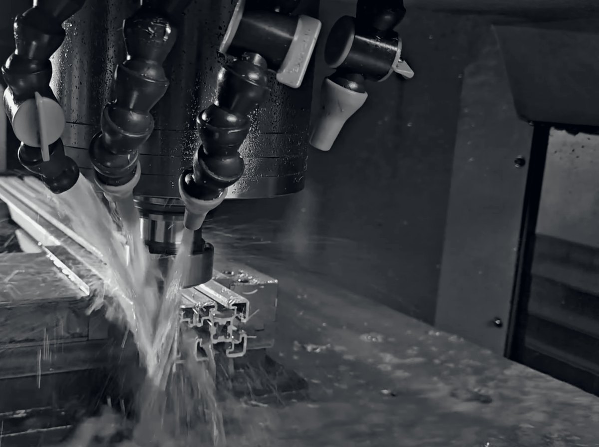 Our 4545 aluminium extrusion being cut on a CNC mill, coolant running over the profile